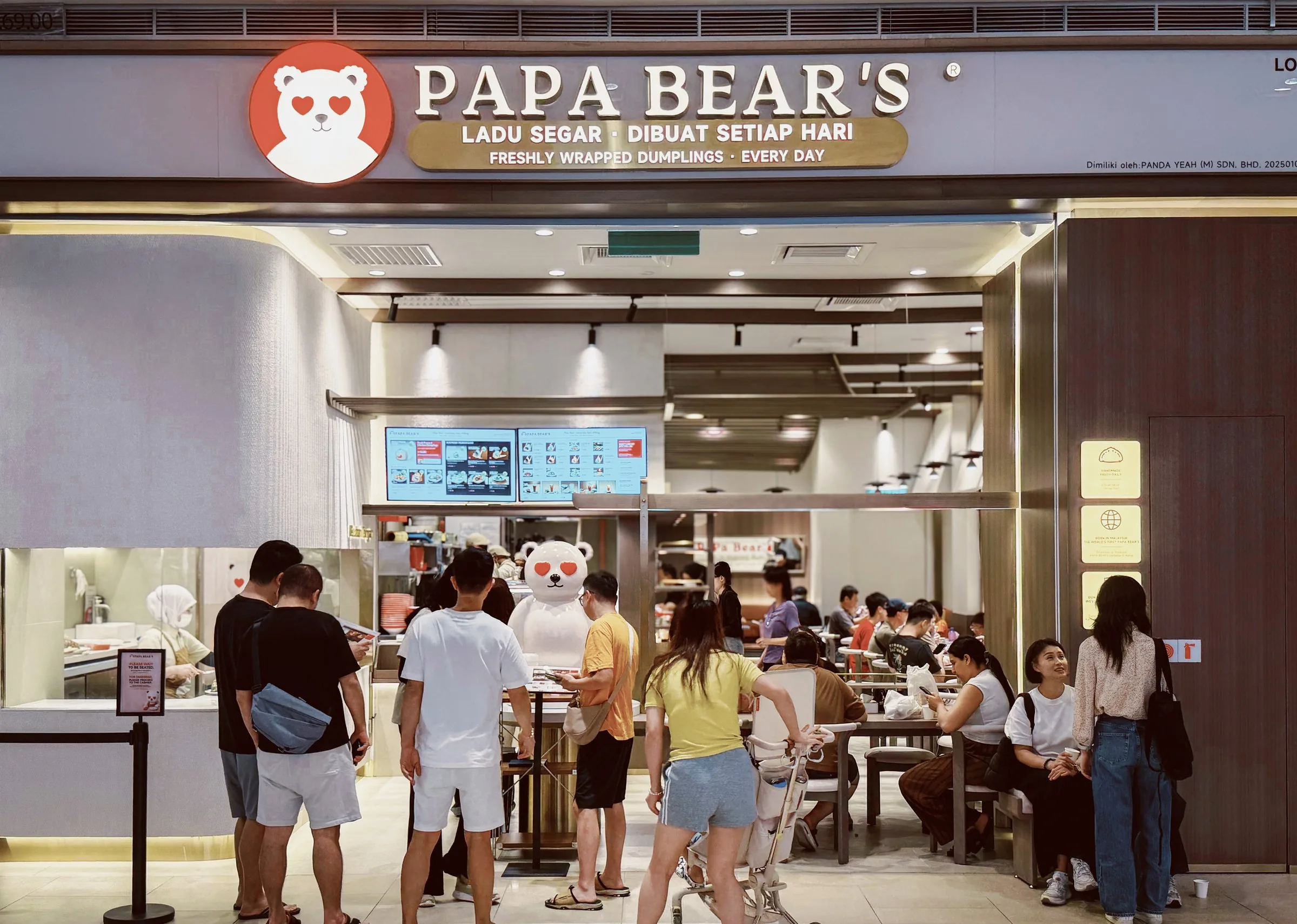 PAPA BEAR’S storefront and white heart-eyed bear character